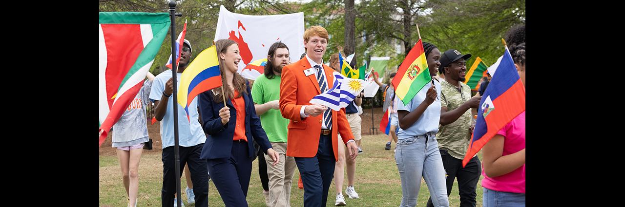 People walking and carrying flags.